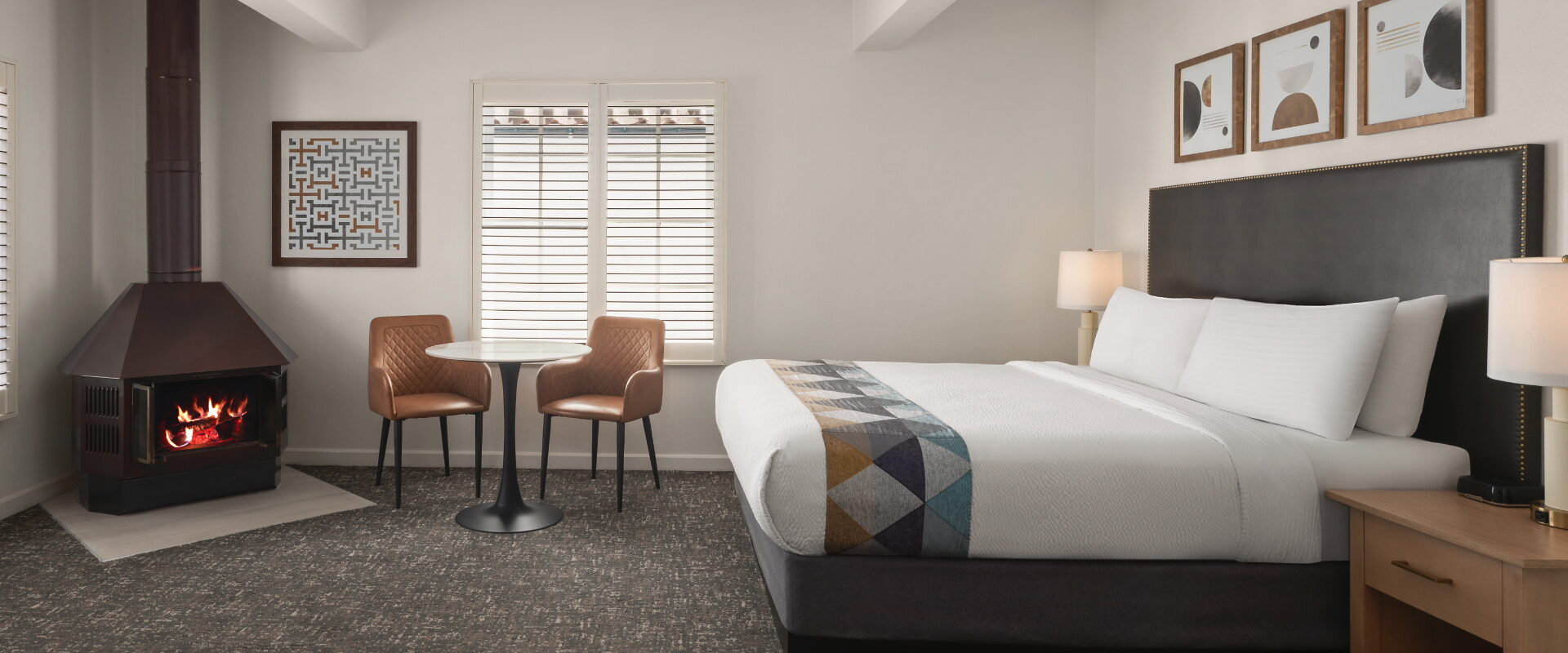 Bedroom with bed and two chairs